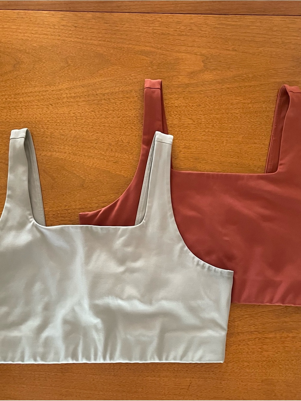 TWO girlfriend collective Tommy sports bras in agave and Sedona